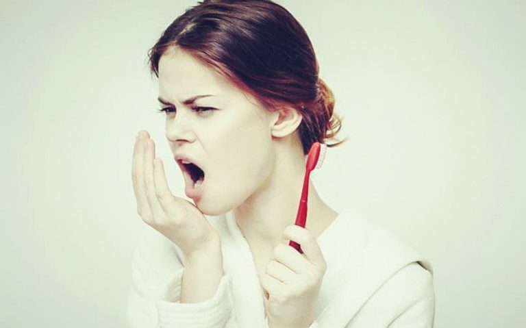 Why Does My Breath Smell Like Poop? Causes and Treatment